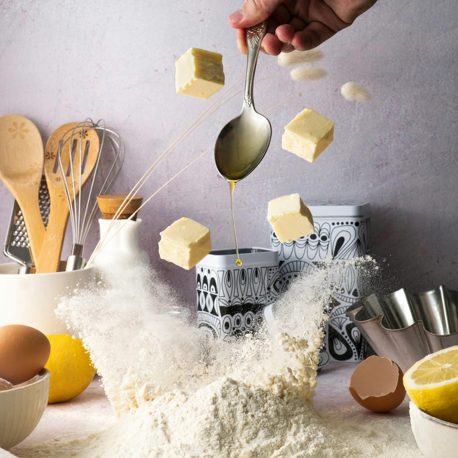 Community members collaborating in a contemporary kitchen, sharing recipes and techniques